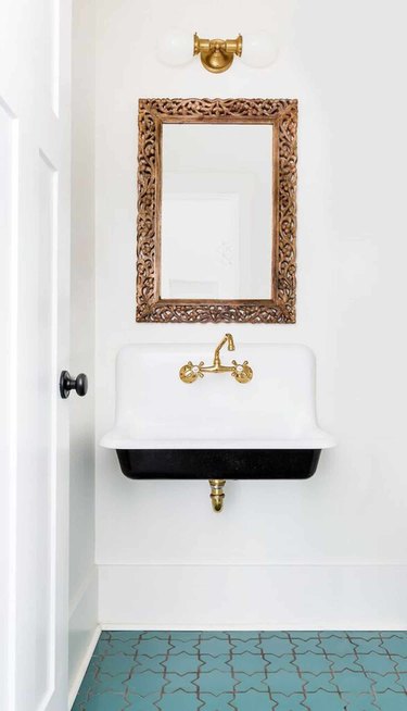 gold and white bathroom mirror lighting ideas above gold mirror in bathroom with blue tile