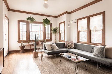 thin roman shades family room window treatments with gray sectional and jute rug