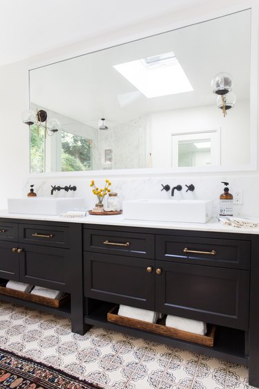 black double vanity with bathroom mirror lighting ideas and black faucets