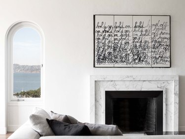 minimalist living room with marble fireplace surround