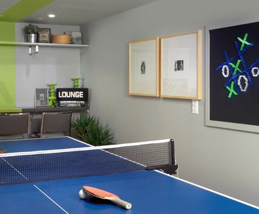 basement game room ideas with blue ping pong table, and chalkboard