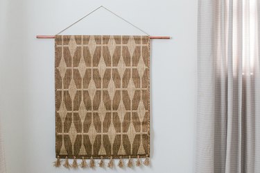 OK, We'll Tell You: Here's How We Turned an Entryway Rug Into Wall Art ...