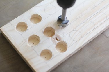 Drilling holes into board