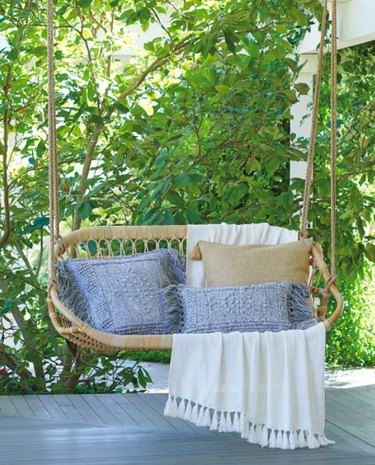 Outdoor hanging swing for two pillows and blankets