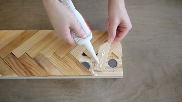 Gluing paint sticks to board