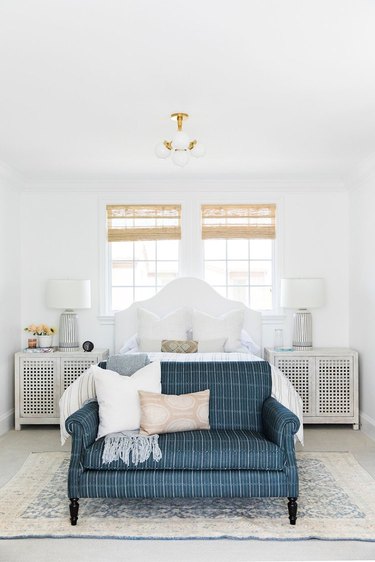 Traditional bedroom with symmetrical nightstands and lamps