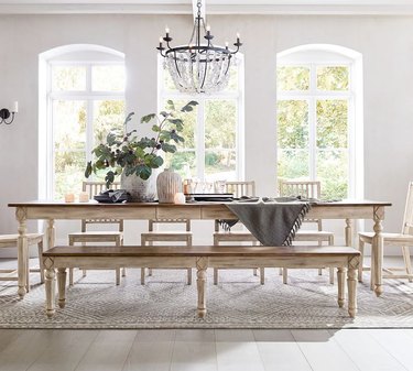 white traditional dining room with wooden table