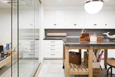 basement apartment kitchen with glass wall and island