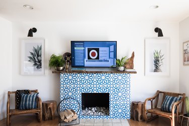 coastal themed living room with mosaic fireplace and reclaimed wood furniture