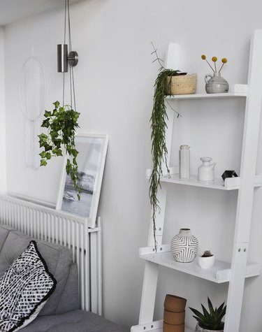 Living room storage ideas with leaning ladder