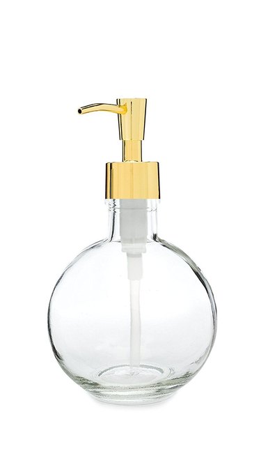 Round glass soap dispenser with gold pump