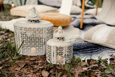 Two metal lanterns with flameless candles