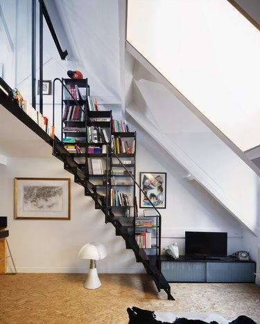 floating stairs with built-in bookcase