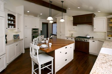 triangle kitchen island in traditional space with wood countertop