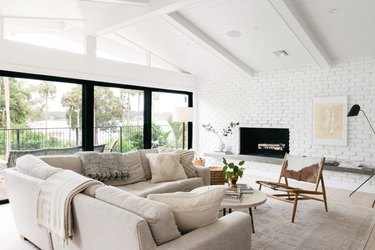 living room with white brick wall