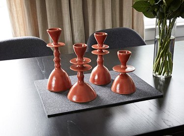 four candlesticks on table