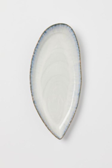 white stoneware serving dish with blue border