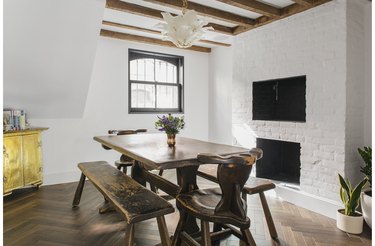 rustic basement furniture with table and exposed beams