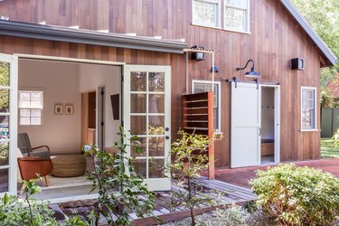 Barn exterior, patio, and outdoor shower