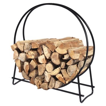 Black metal minimal firewood storage with circular frame