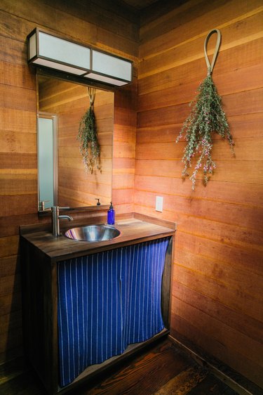 bathroom with royal blue curtain