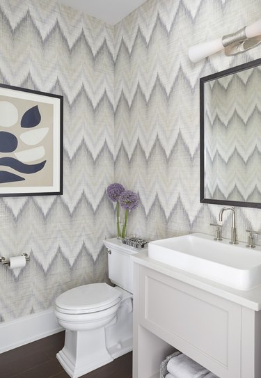 Budget bathroom remodel with patterned wallpaper