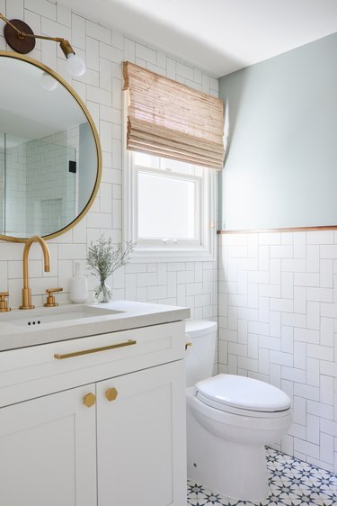 Modern white budget bathroom remodel with white wall tile and patterned floor tile