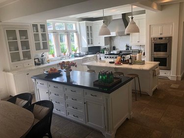 all-white kitchen with double island and countertops