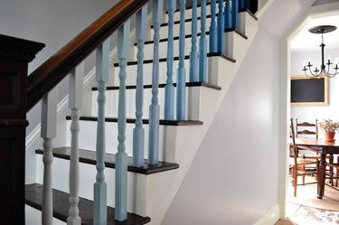 blue ombre spindles with wood stair railing and banister