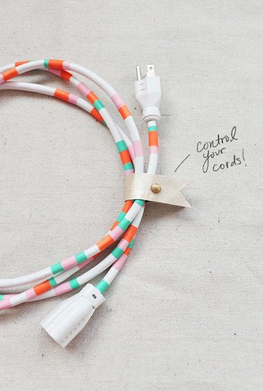 A white cord with colorful washi tape