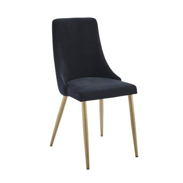 Minimal black velvet armless dining chair with four gold legs.