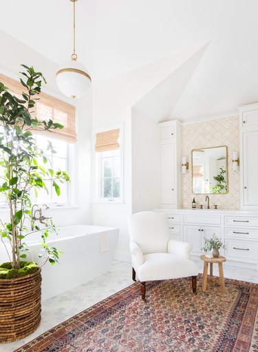 traditional bathroom backsplash in all-white bathroom