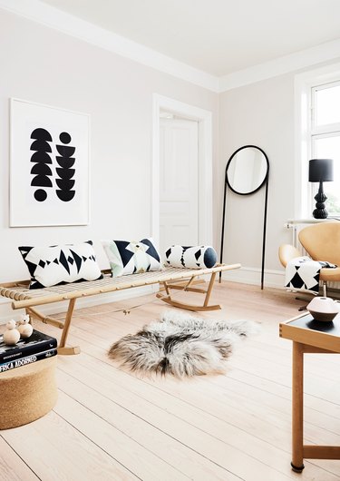 Scandinavian-inspired daybed in the living room idea with rocking daybed and patterned throw pillows