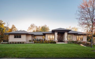 craftsman style ranch house seen from the outside with trees nearby