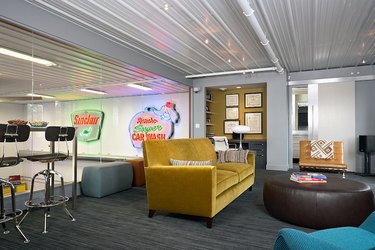 basement man cave ideas with yellow velvet couch and neon signs