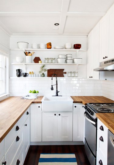 White kitchen design with white subway tile backsplash