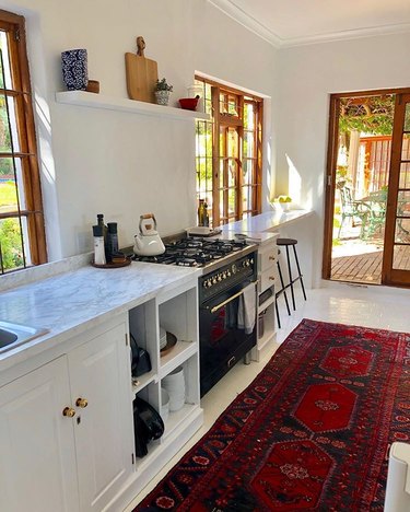 marble contact paper for countertops in kitchen with red rug