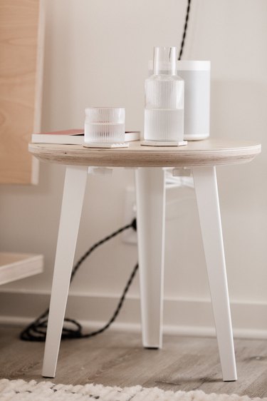birch plywood side table with glass carafe and speaker