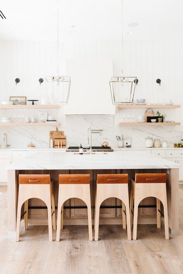 Desert-Themed Kitchen with white cabinets and marble backsplash by Studio McGee