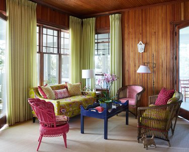 living room sofa ideas with bright pops of color and green drapery