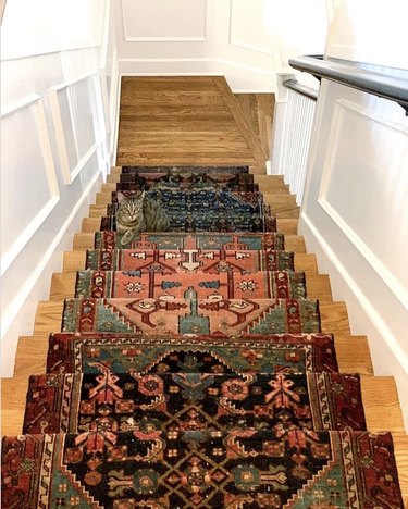 Persian rug stair runners on wood stairs