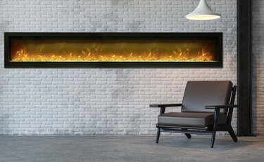 long basement fireplace set in white brick wall with hanging pendant