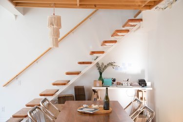 floating staircase idea with wood stair railing