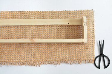 Wooden shelf with cane webbing