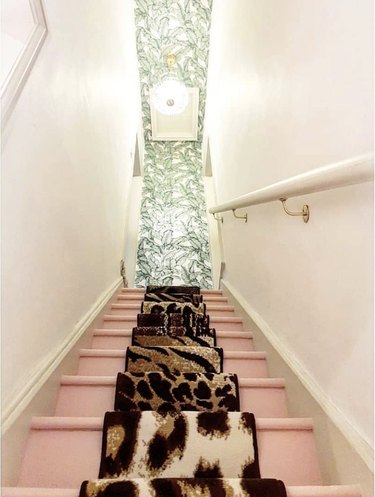 Leopard-print stair runners on top of pink stairs