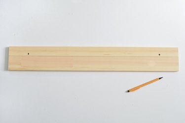 Wooden shelf with cut line drawn in pencil