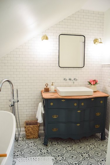 spa bathroom ideas with vintage dresser as vanity cabinet and patterned floor tile