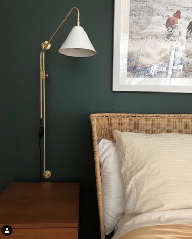 bedroom lighting ideas with French pole light wall sconce next to woven headboard