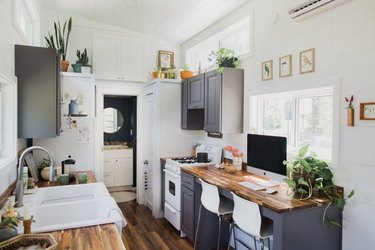 modern tiny house with gray cabinets in kitchen