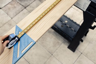 Measuring wood board with a HART tape measure